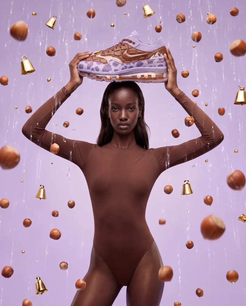 A concept photographed by EZZAR: a figure holding a slab of moulded chocolate.