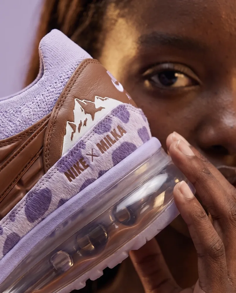 A finished photograph from the shoot: the sneaker held to camera.