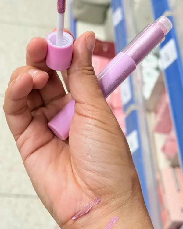 The crayon opened on its liquid shadow wand, taken on a phone.